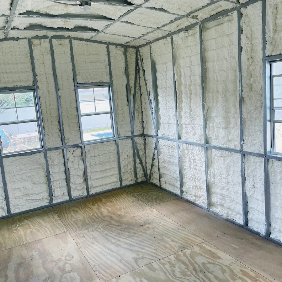 Closed-cell spray foam insulation applied to wall cavities in a residential project in Greenwich